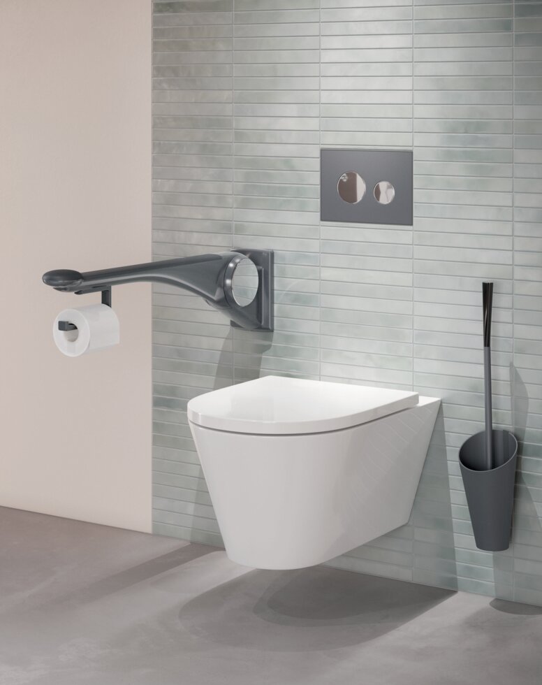 WC equipped with folding support handle and toilet brush in the color anthracite matt